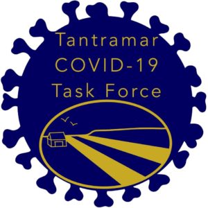 The Tantramar COVID-19 Task Force logo is shown. The logo has the group name in yellow writing, the background is the COVID-19 virus all in blue.
