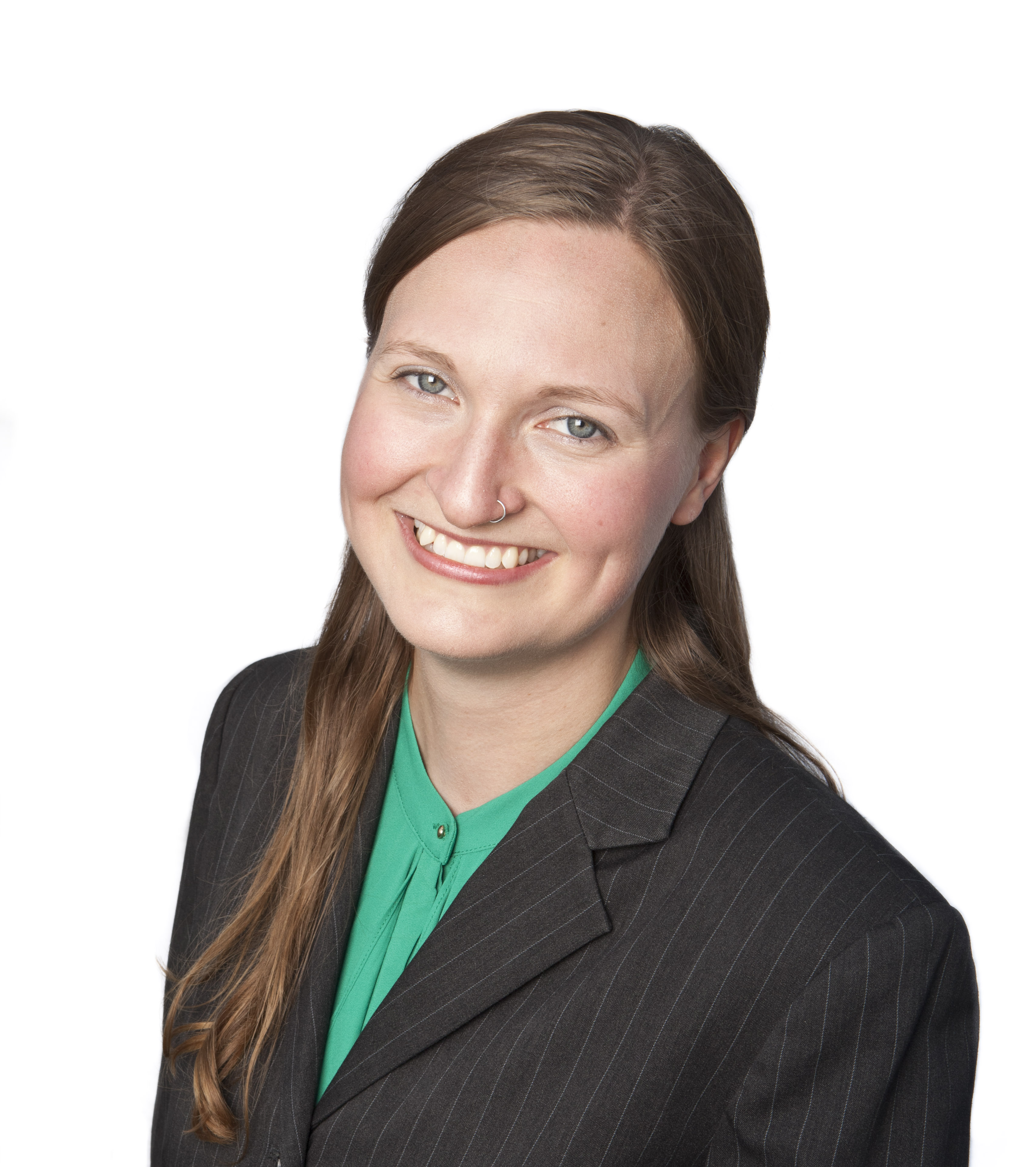 Megan Mitton smiles, wearing green.