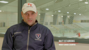 A still of Matt Estabrooks in a hockey rink.