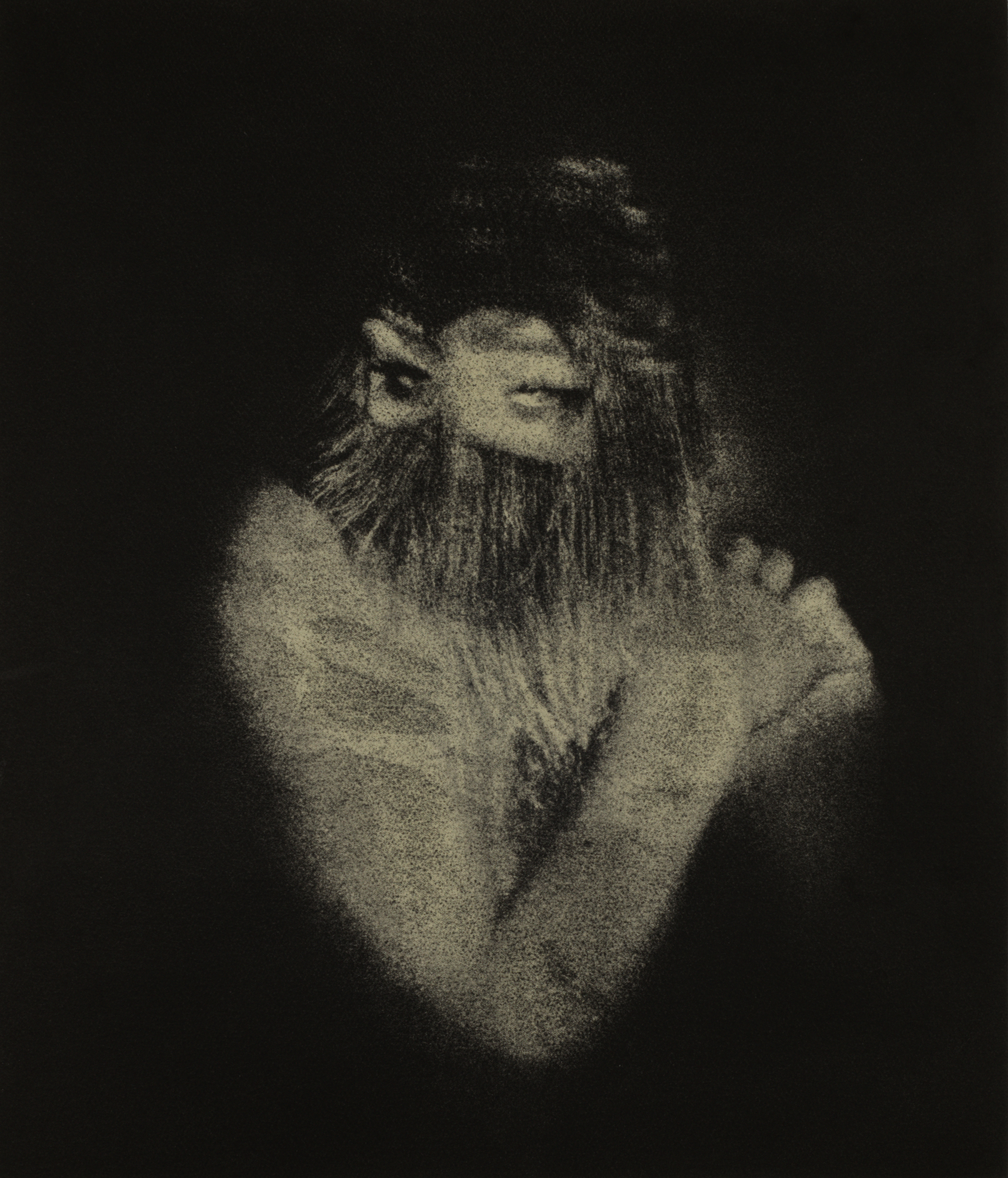 A distorted photo of a person in black and white.