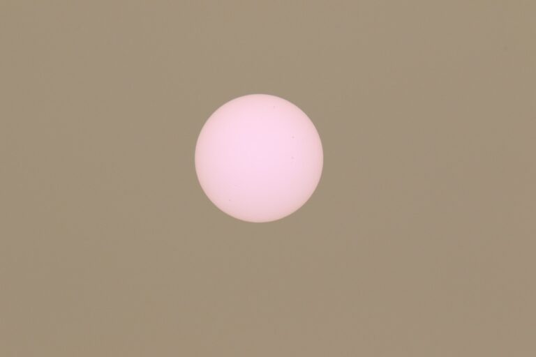 Pale, pink sun seen in New Brunswick due to wild fire smoke high in the atmosphere